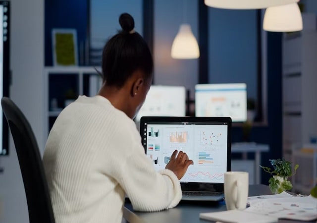 female manager checking business statistics and financial reports